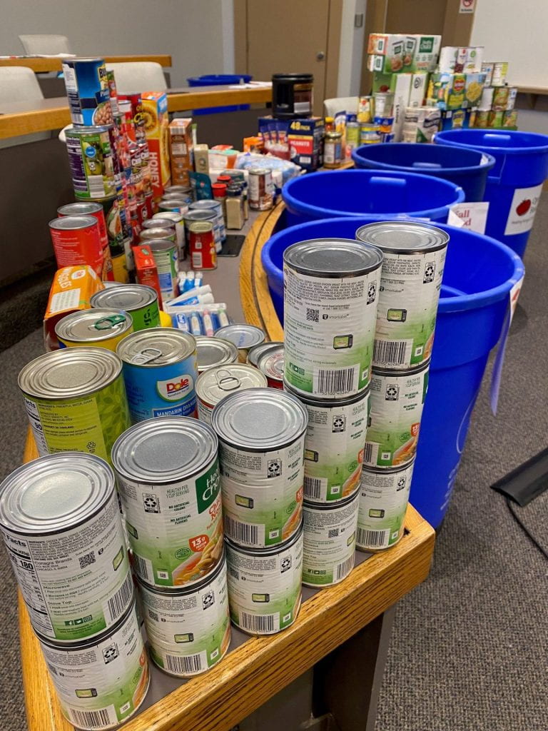 donated food items, including canned goods, rice, and beans