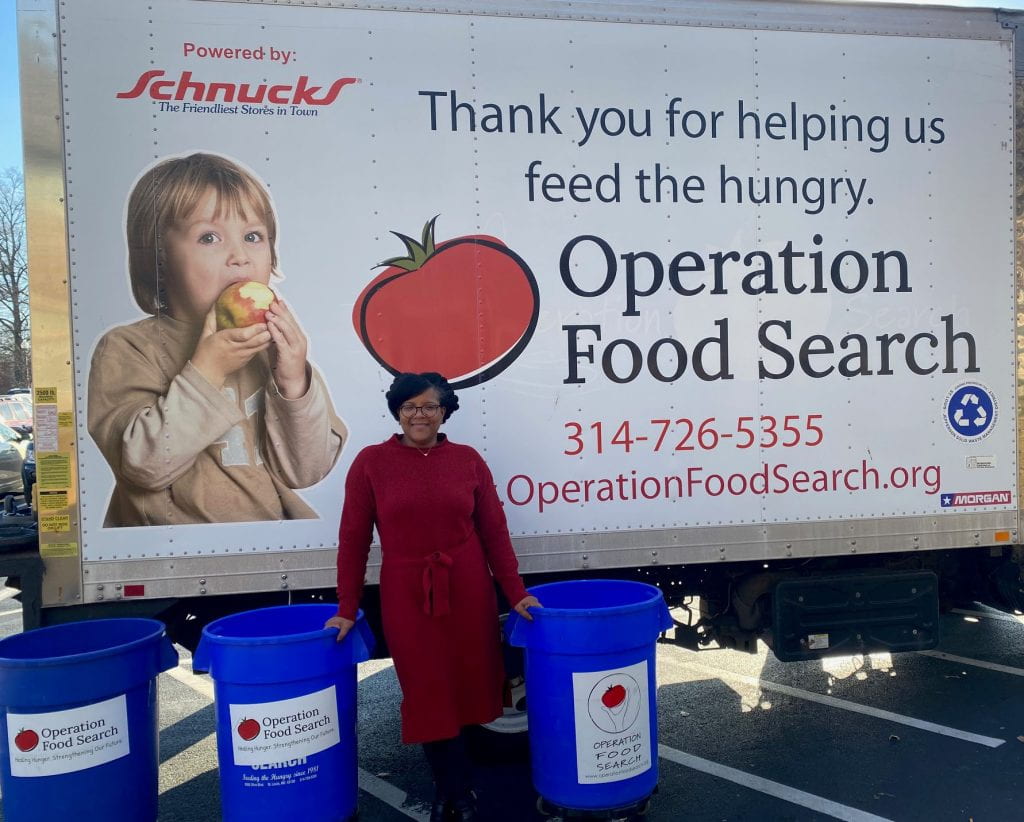 DSC member Genesis Steele in front of operation food search donation truck